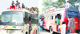 Throwing norms to the wind: Overloaded buses ply on a road in Amritsar.