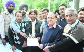 Mayor Bakshi Ram Arora (second from right) at a property tax camp in Amritsar on Tuesday.