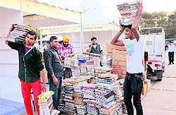 Shopkeepers set up stalls for the book fair at the Parade Ground in Sector 17, Chandigarh, on Tuesday