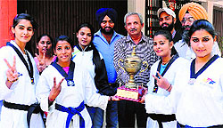 The winning team with the trophy in Patiala