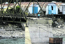 A bridge in Uttarkashi that was damaged in the mid-June natural disaster is yet to be repaired. A Tribune photograph