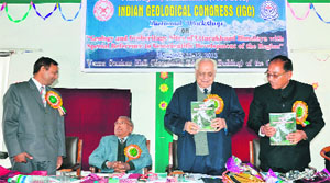 OP Varma, Chairman of the Indian Geological Congress, releases a souvenir at a national workshop held at LSM Government PG College in Pithoragarh on Tuesday.