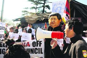 Exiled Tibetans hold a protest at McLeodganj on Tuesday