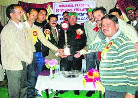 Speaker Brij Behari Lal Butail gets a warm welcome at the state-level SC/ST government employees meeting in Palampur on Sunday