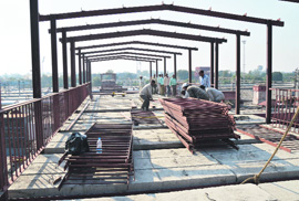 Work under way on a foot overbridge at the Ludhiana railway station.