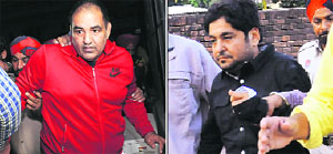 Former DSP Jagdish Bhola and (right) his accomplice Sarabjit Singh Saba at district court in Mohali on Tuesday. 