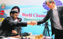 Viswanathan Anand and Magnus Carlsen during their third match at FIDE World Chess Championship in Chennai on Tuesday.  PTI 