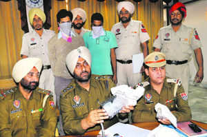DSP Harmik Singh Deol shows drugs seized by the police in Bathinda on Wednesday.