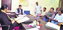 Haridwar District Magistrate Nidhi Pandey and other officials discuss methods to prevent the spread of dengue in Haridwar on Wednesday. Tribune photo: Rameshwar Gaur