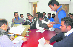 Students apprise DAV College Principal Devender Bhasin of their demands in Dehradun on Wednesday. Tribune photo: Vinod Pundir