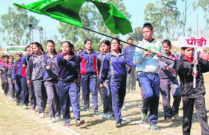 A contingent of Pauri Garhwal district stage a march past during the inaugural function of the 2nd state-level primary educational school mini sports meet in Haridwar on Wednesday. 