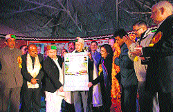 Chief Minister Virbhadra Singh releases a calendar for 2014 from the Renu Manch on the occasion of the Renuka Fair on Tuesday evening.