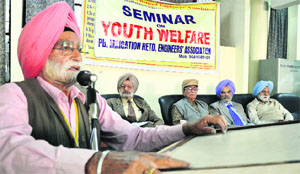 A member of the Punjab Irrigation Retired Engineers Association speaks during a seminar on youth welfare at the Pensioners Bhawan in Ludhiana on Wednesday