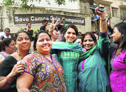 Residents of Campa Cola society celebrate after the Supreme Court orders in Mumbai on Wednesday.