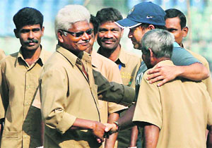 Sachin interacts with the ground staff in Mumbai on Wednesday. 