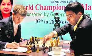 Anand makes a move against Carlsen during their fourth match at World Championship on Wednesday