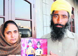 The victim's aggrieved parents with his picture (Gurkirat at right) at their residence in Verka. 