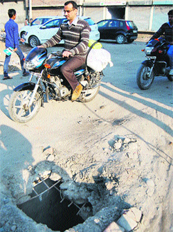An open manhole near the Banke Bihari street on the Batala road in Amritsar which has been posing a threat to the lives of commuters for the past three months.