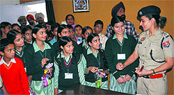 DSP Rupinder Kaur Saran interacts with special children on the occasion of Childrens Day at the Civil Lines police station in Bathinda on Thursday