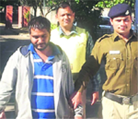 Sompal in police custody in Chandigarh on Thursday.  Tribune photo: Manoj Mahajan 