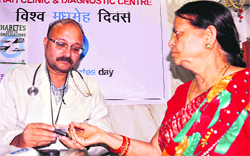 A diabetic patient being checked by endocrinologist Dr Sanjay Shah during a camp on World Diabetes Day in Haridwar on Thursday. Tribune photo: Rameshwar Gaur