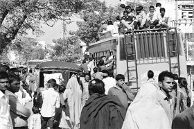 People board private buses on the second day of the roadways strike in Karnal on Thursday.