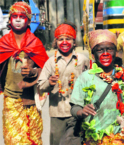 Children beg, dressed as Hindu gods, to earn their livelihood on Childrens Day in Karnal.