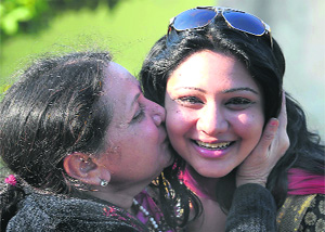 Kruti Parekh, who claims to be countrys first test-tube baby, being kissed on cheek by her mother Jaishri Parekh during the Childrens Day celebrations in Jalandhar on Thursday.