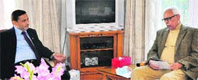 Governor NN Vohra with Irrigation and Flood Control Minister Sham Lal Sharma at Raj Bhawan in Jammu on Thursday