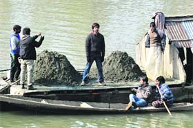 Shooting star: Bollywood actor Shahid Kapoor shoots for Vishal Bhardwaj's upcoming film Haider in the Jhelum on the outskirts of Srinagar on Thursday