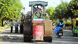 Repair work in progress on a road ahead of Deputy Chief Minister Sukhbir Singh Badals visit to Ludhiana, on Thursday