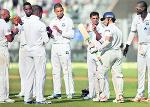 West Indian players line up to show their respect as Sachin Tendulkar walks in to bat at Wankhede Stadium in Mumbai on Thursday. 