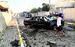 The site of a car bomb attack in Kirkuk on Thursday