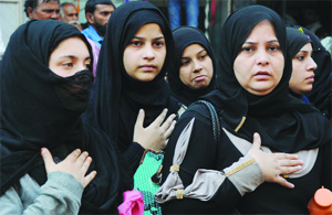 Muslim women beat their chests as they take part in a ritual of self-flagellation during the Muharram procession in New Delhi on Friday.