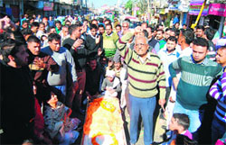 Family members of the deceased PHE worker protest against the state government in Jammu on Friday
