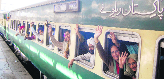 Pakistan-bound Sikh pilgrims at the railway station in Amritsar on Friday and (left) the pilgrims at the SGPC office inside the Golden Temple complex. Photos: Sameer Sehgal