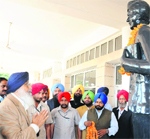 Chief Minister Parkash Singh Badal pays tributes to Kartar Singh Sarabha at Sarabha village in Ludhiana on Friday. Tribune photo