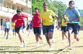 Students participate in an athletics event during the annual sports meet at St Josephs Academy in Dehradun