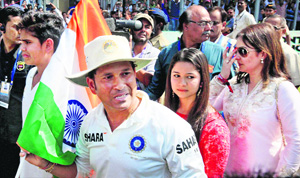 A tearful Sachin with his family at the presentation ceremony.