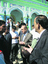 Union Health Minister Ghulam Nabi Azad interacts with locals at a Sufi shrine in Kishtwar on Saturday