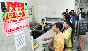 Pilgrims planning to visit Vaishno Devi at a counter to receive biometric yatra slips at Saraswati Dham in Jammu on Saturday