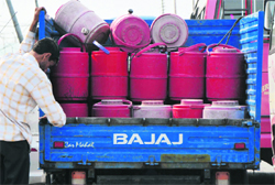 A man distributes mineral water in Jammu on Saturday. Tribune Photo: Inderjeet Singh
