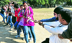 Students and faculty members take part in a tug-of-war competition at the Sportking Institute of Fashion Technology in Ludhiana on Saturday