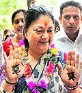 BJP leader Vasundhara Raje shows her party symbol lotus  made of heena  in Jaipur on Saturday