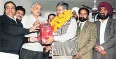 Traders honouring Bathinda (Urban) MLA Sarup Chand Singla during a function organised on Sunday. Photo: Bhupinder Dhillon