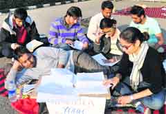 Students sit on a protest outside the Vice-Chancellors office. Tribune photo: Manoj Mahajan
