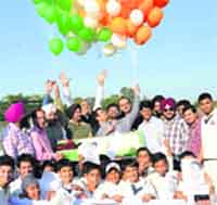 Budding cricketers with the members of the UT Cricket Association celebrate Sachin Tendulkars retirement at the Cricket Stadium, Sector 16, in Chandigarh. 