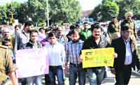 Members of the Yuva Shakti Foundation hold a protest at Sector 9 in Chandigarh on Sunday.