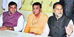 State BJP president Ram Vilas Sharma addresses a press conference in Karnal on Sunday