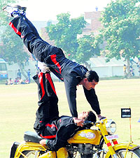 Students perform stunts during the alumni meet of Sainik School Kunjpura in Karnal on Sunday